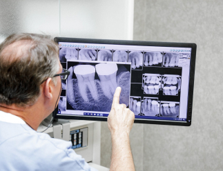 dr. seale looking at a dental x-ray