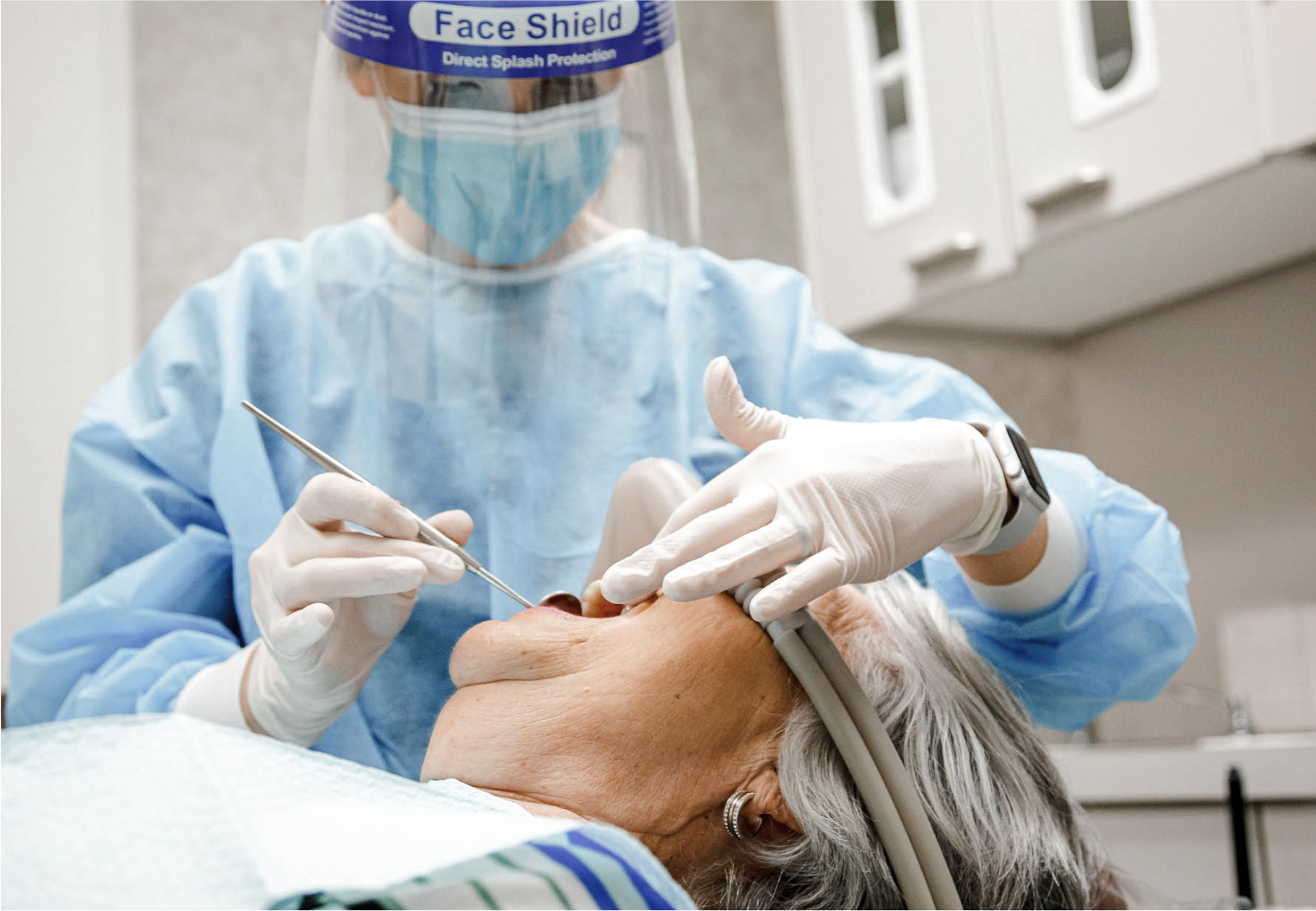 dentist performing a procedure on a patient