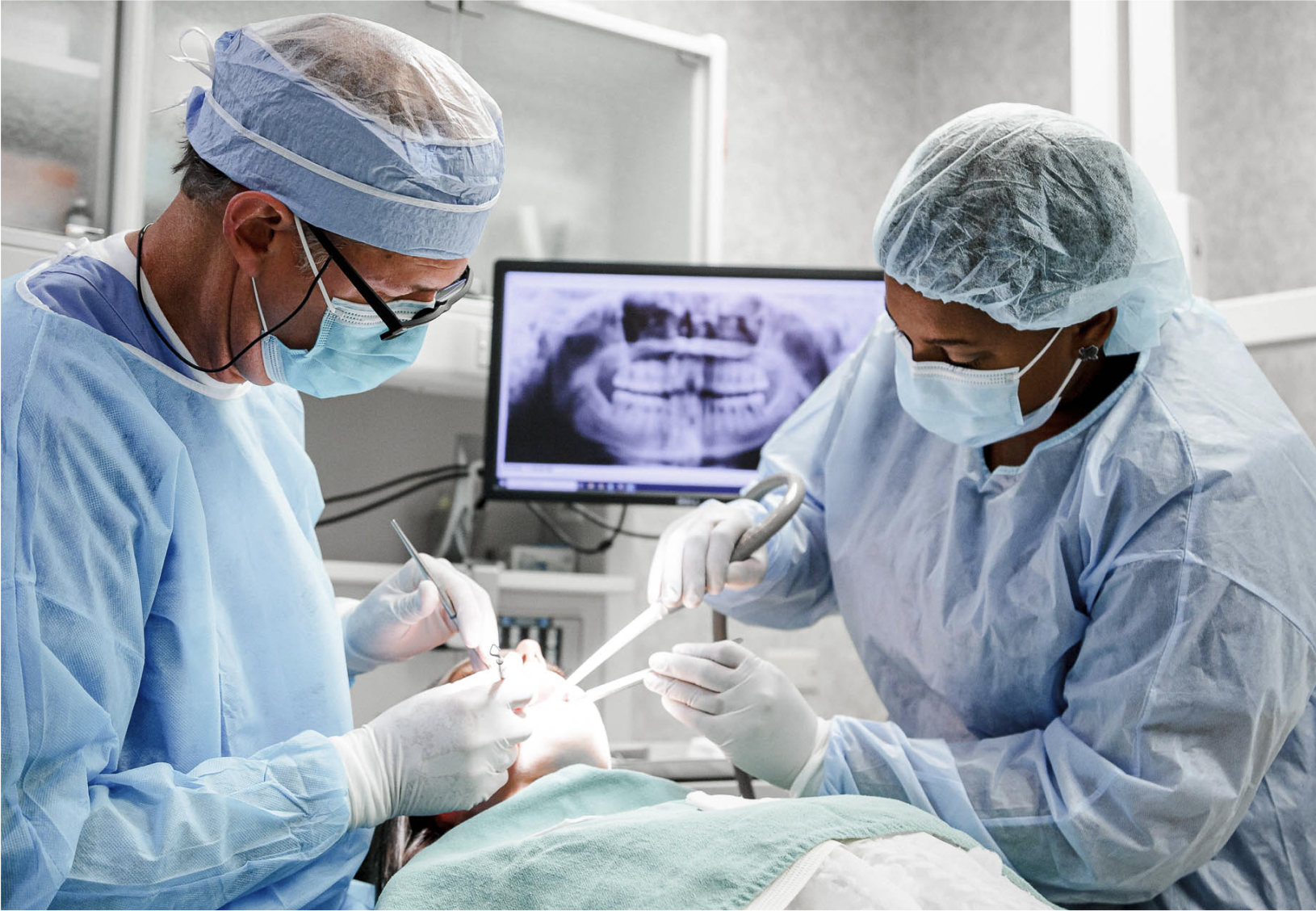 Dr. Seale and assistant working with a patient