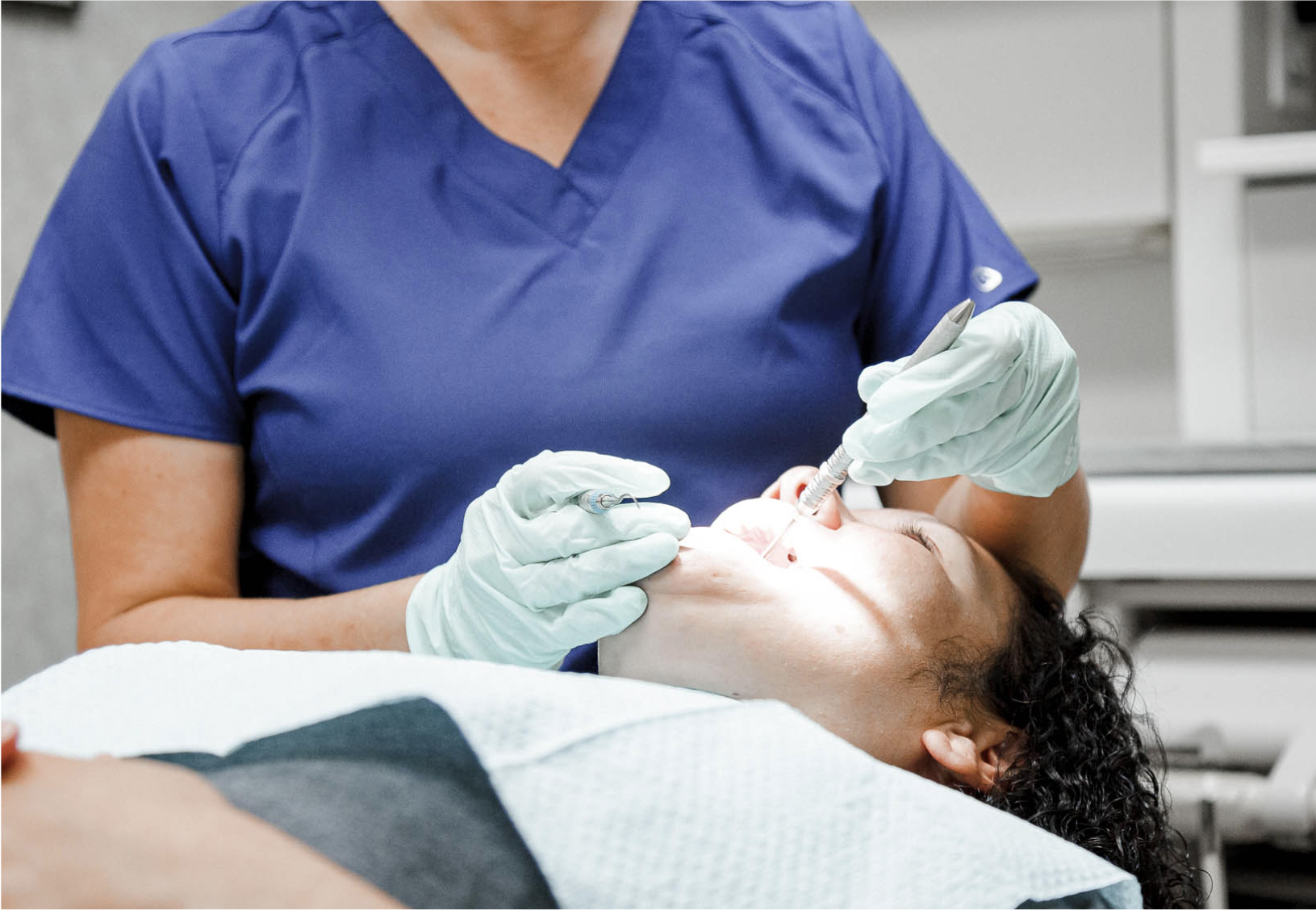 dentist performing a procedure on a patient