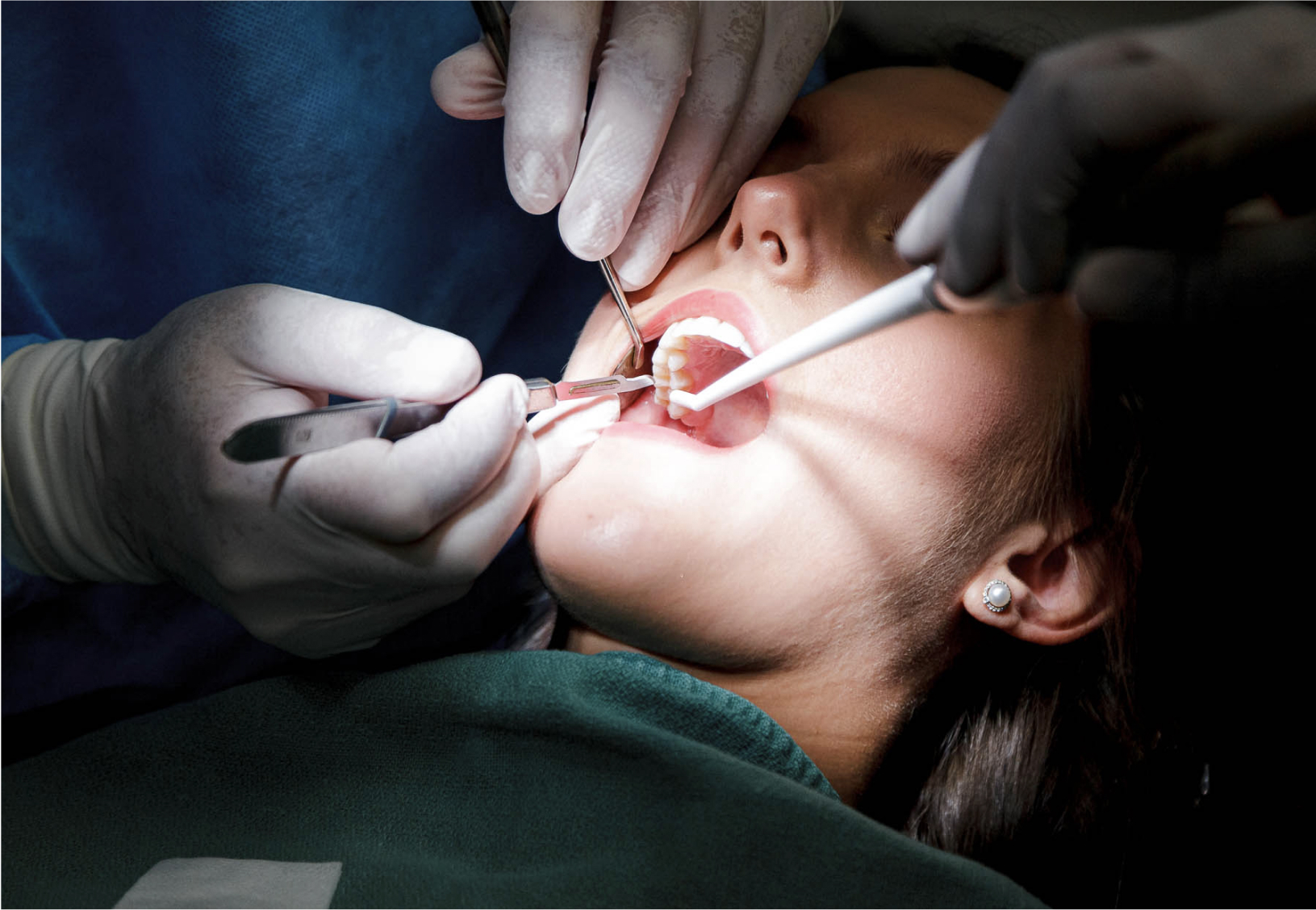 dentist performing a procedure on a patient